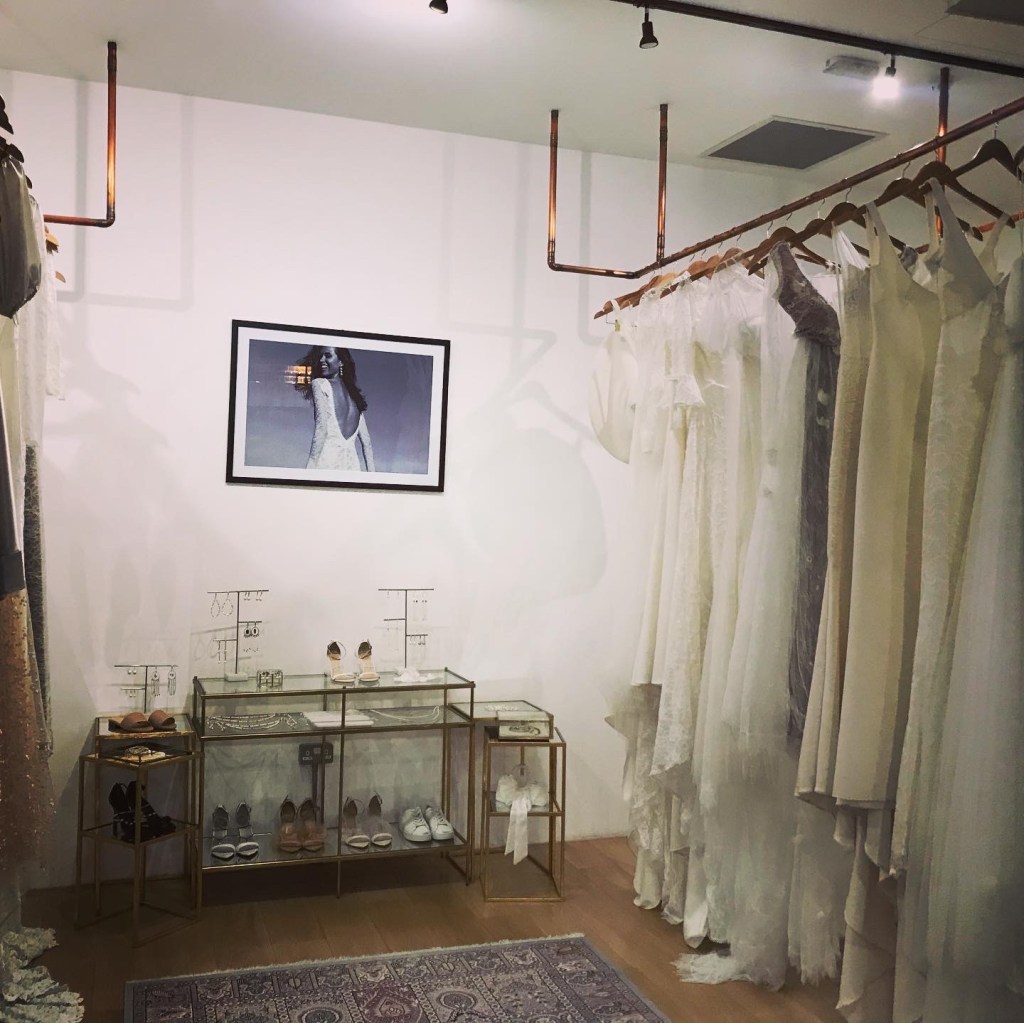 a bridal showroom with a selection of dresses